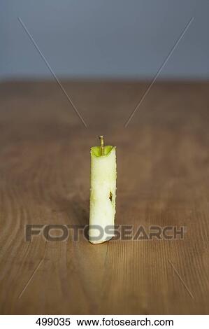 Apple core on a wooden table View Large Photo Image Stock Photography - Apple core on a wooden table. Fotosearch