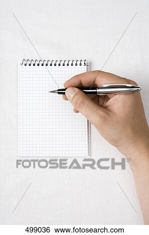 Stock Photograph - Detail of a man with a notepad and pen. Fotosearch