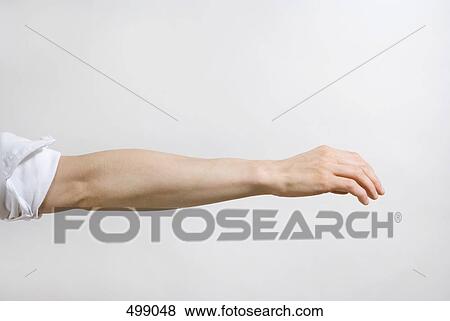 Detail of a man's arm outstretched View Large Photo Image Stock Photo - Detail of a man's arm outstretched. Fotosearch