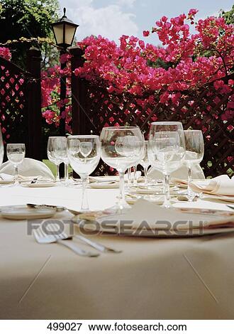 Stock Photo - Place settings at a hotel restaurant. Fotosearch