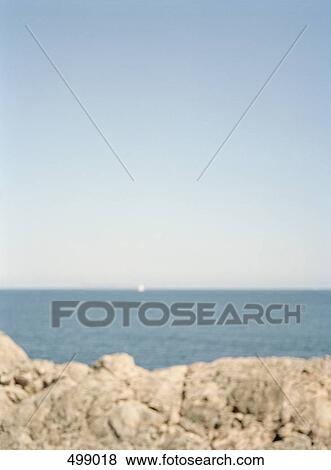View over a rocky coastline out to sea View Large Photo Image Stock Photo - View over a rocky coastline out to sea. Fotosearch