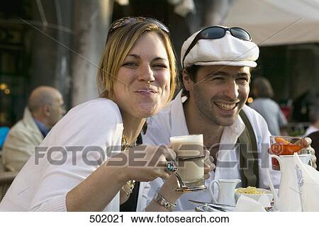 A couple sitting at a pavement cafe in Venice View Large Photo Image Stock Image - A couple sitting at a pavement cafe in Venice. Fotosearch