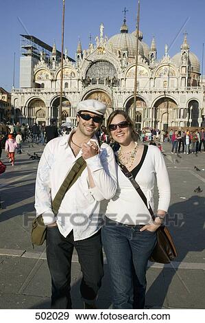 Couple in front of St Mark's Cathedral, Venice View Large Photo Image Stock Photo - Couple in front of St Mark's Cathedral, Venice. Fotosearch