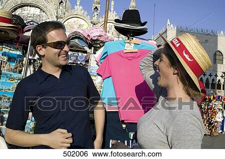 Couple trying on tourist hats in Venice View Large Photo Image Stock Photograph - Couple trying on tourist hats in Venice. Fotosearch