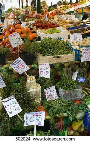 Fruit and vegetables on a market stall View Large Photo Image Picture - Fruit and vegetables on a market stall. Fotosearch
