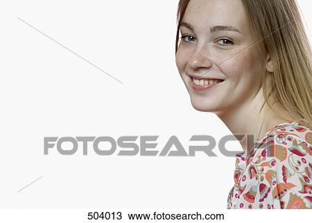 A portrait of a young woman smiling View Large Photo Image Stock Image - A portrait of a young woman smiling. Fotosearch