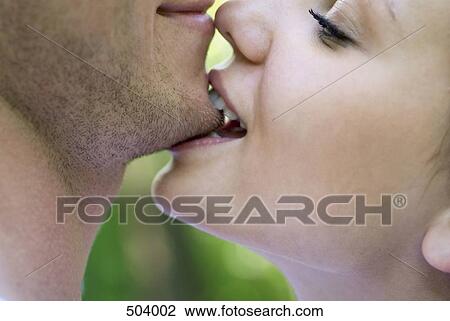 A woman biting a man's chin View Large Photo Image Stock Image - A woman biting a man's chin. Fotosearch
