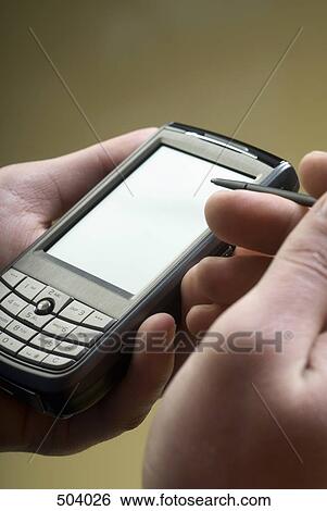 Detail of a woman using a mobile phone with a digitized pen View Large Photo Image Stock Photograph - Detail of a woman using a mobile phone with a digitized pen. Fotosearch