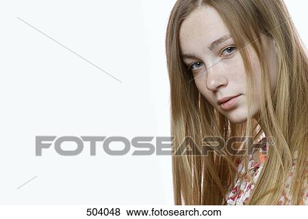 Stock Photo - Portrait of a young woman staring. Fotosearch
