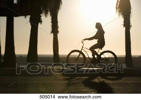 A girl cycling at the beach View Large Photo Image Picture - A girl cycling at the beach. Fotosearch