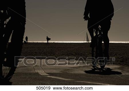 Cyclists by the beach View Large Photo Image Stock Photo - Cyclists by the beach. Fotosearch