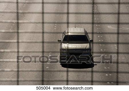 View through wire mesh of a car below View Large Photo Image Picture - View through wire mesh of a car below. Fotosearch