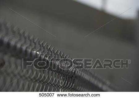 Wire mesh fence View Large Photo Image Stock Photo - Wire mesh fence. Fotosearch