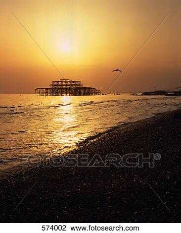 Stock Image - Brighton Pier at sunset. Fotosearch