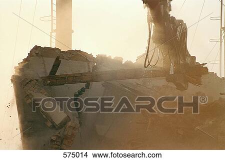A demolition crane demolishing a building View Large Photo Image Picture - A demolition crane demolishing a building. Fotosearch