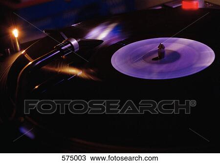 A record playing on a record player View Large Photo Image Stock Image - A record playing on a record player. Fotosearch