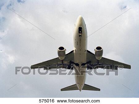An aero plane flying View Large Photo Image Stock Photograph - An aero plane flying. Fotosearch