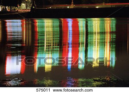 Multi colored lights reflected on water View Large Photo Image Stock Image - Multi colored lights reflected on water. Fotosearch