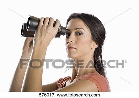 A woman looking through binoculars View Large Photo Image Stock Photo - A woman looking through binoculars. Fotosearch