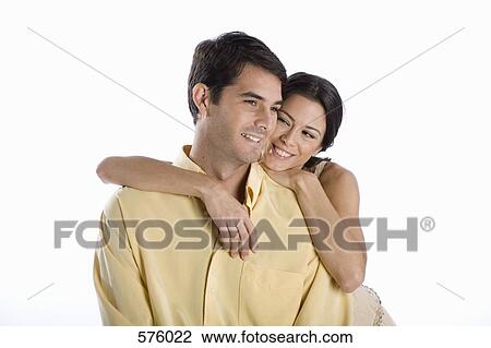 A young couple smiling View Large Photo Image Stock Image - A young couple smiling. Fotosearch