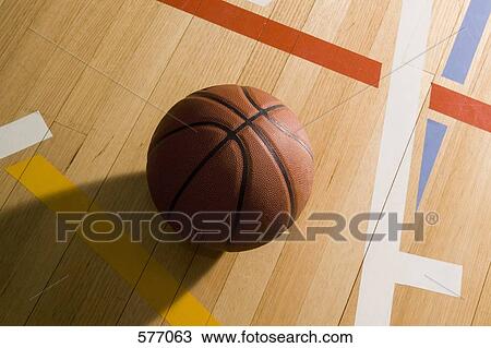 A close-up of a basketball on a basketball court View Large Photo Image Stock Image - A close-up of a basketball on a basketball court. Fotosearch