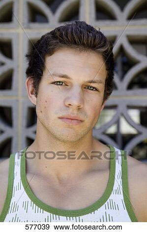 A portrait of a young adult man View Large Photo Image Stock Photo - A portrait of a young adult man. Fotosearch