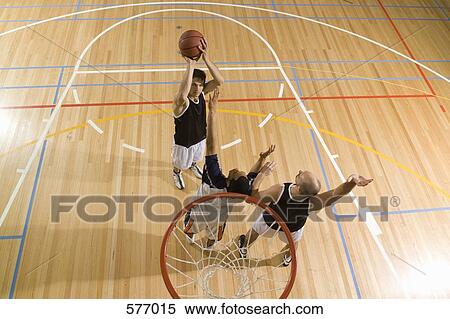 Three young man playing basketball View Large Photo Image Stock Photography - Three young man playing basketball. Fotosearch