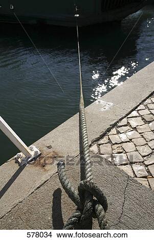 a taunt rope tied to land View Large Photo Image Picture - a taunt rope tied to land. Fotosearch
