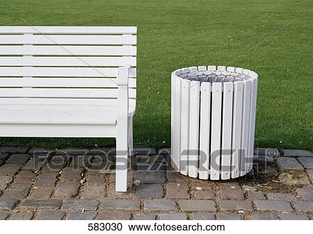 A White Bench And Rubbish Bin Stock Image 583030 Fotosearch