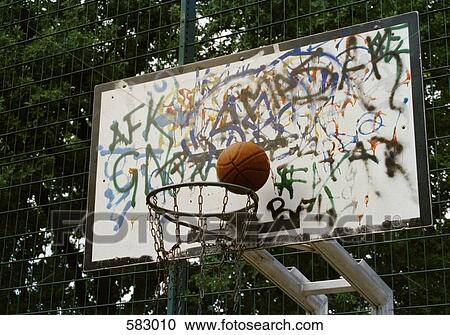 Basketball going into a basketball hoop View Large Photo Image Stock Image - Basketball going into a basketball hoop. Fotosearch