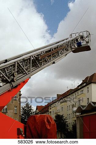 Fire truck ladder extended into the sky View Large Photo Image Stock Photograph - Fire truck ladder extended into the sky. Fotosearch