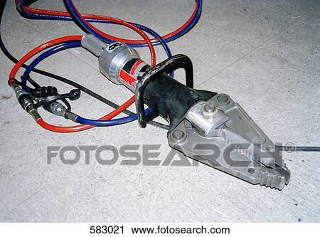 Stock Image - Hydraulic Rescue Tool used for prying open doors. Fotosearch