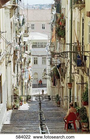 Stock Image - A steep street in Lisbon, Portugal. Fotosearch