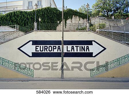 Stock Photograph - Arrow sign pointing up steps, Portugal. Fotosearch