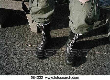 View of a man's legs sitting on a bench View Large Photo Image Stock Image - View of a man's legs sitting on a bench. Fotosearch