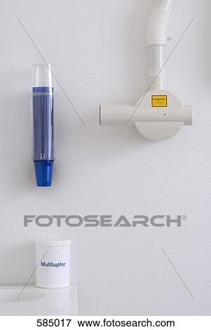 Dental Intraoral X-ray system with plastic drinking cup dispenser and jar of swabs View Large Photo Image Stock Photo - Dental Intraoral X-ray system with plastic drinking cup dispenser and jar of swabs. Fotosearch