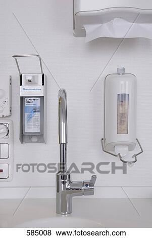 Hand sink, soap and disinfectant dispenser and paper towel dispenser View Large Photo Image Stock Photo - Hand sink, soap and disinfectant dispenser and paper towel dispenser. Fotosearch