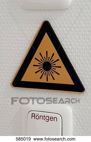 Stock Photo - X-ray switch and laser radiation warning sign. Fotosearch