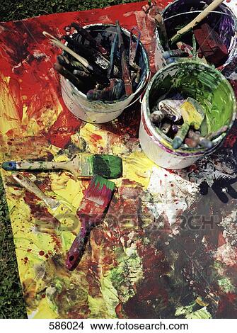 High Angle View of messy buckets of paint and paintbrushes View Large Photo Image Picture - High Angle View of messy buckets of paint and paintbrushes. Fotosearch