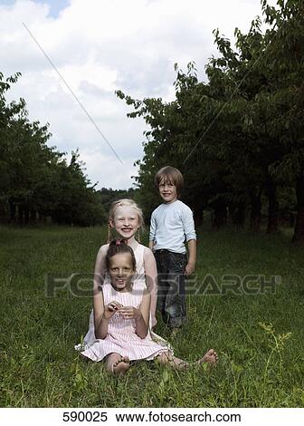 Three children in a garden View Large Photo Image Stock Photography - Three children in a garden. Fotosearch