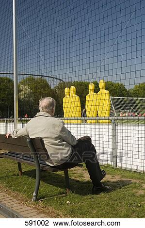 A man watching a football practice View Large Photo Image Stock Image - A man watching a football practice. Fotosearch