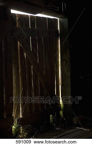 Light shining into a dark shed View Large Photo Image Stock Photo - Light shining into a dark shed. Fotosearch