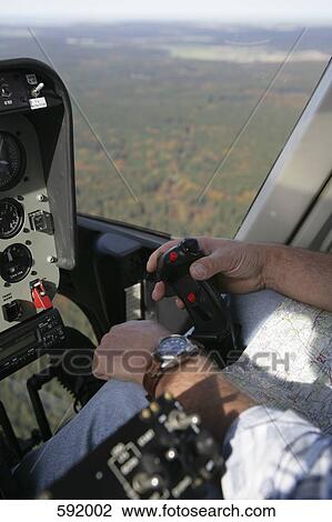 Stock Image - A pilot flying an aero plane. Fotosearch