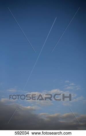 An aero plane in the sky with a vapor trail View Large Photo Image Picture - An aero plane in the sky with a vapor trail. Fotosearch