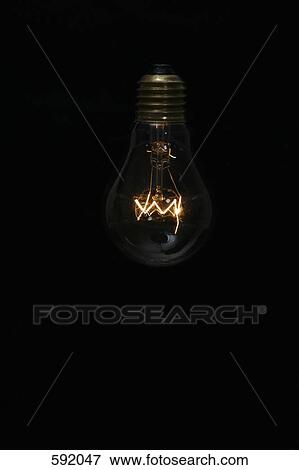 Illuminated light bulb View Large Photo Image Stock Photo - Illuminated light bulb. Fotosearch