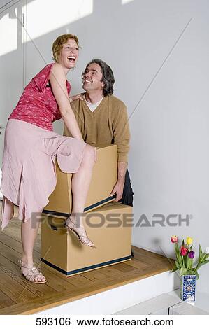 A couple moving house View Large Photo Image Stock Photograph - A couple moving house. Fotosearch