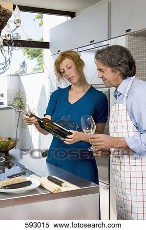 A couple preparing dinner View Large Photo Image Stock Photography - A couple preparing dinner. Fotosearch