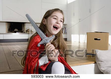 A little girl wearing fancy dress and laughing View Large Photo Image Stock Image - A little girl wearing fancy dress and laughing. Fotosearch