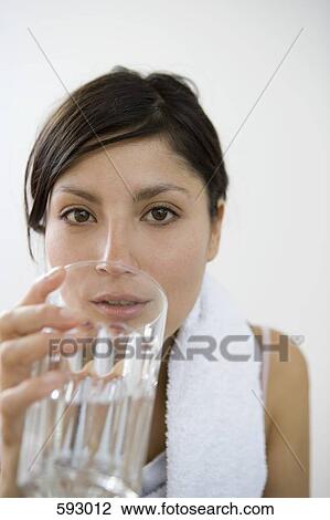 A young woman with a towel around her neck View Large Photo Image Stock Image - A young woman with a towel around her neck. Fotosearch