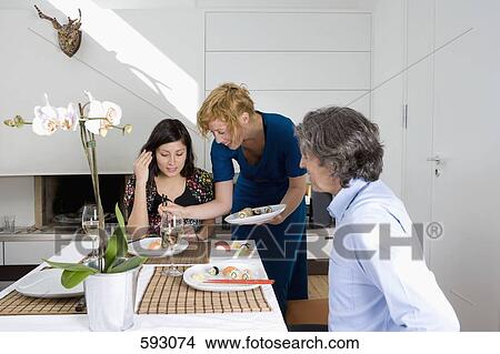 Friends having dinner together View Large Photo Image Picture - Friends having dinner together. Fotosearch